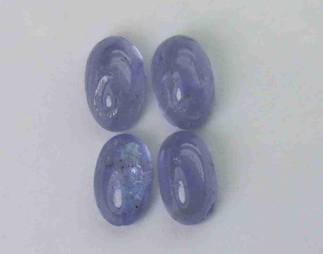 2.03 cts Natural Tanzanite Lot: No Reserve! Gemstone : Natural Tanzanite Shape and cut : Oval cabochan Weight : 2.03 Carats Measurements : 5.83x3.73x2.81 mm - 5.53x3.45x2.23 mm Number of Stone : 4 Color : voilite Transprancy : Trans