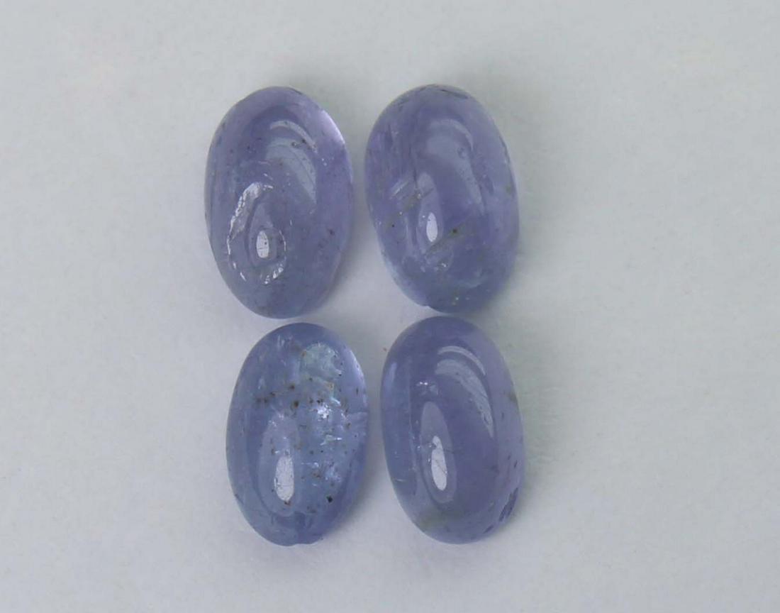 2.22 cts Natural Tanzanite Lot: No Reserve! Gemstone : Natural Tanzanite Shape and cut : Oval cabochan Weight : 2.22 Carats Measurements : 5.85x3.85x2.88 mm - 5.60x3.60x2.52 mm Number of Stone : 4 Color : voilite Transprancy : Trans