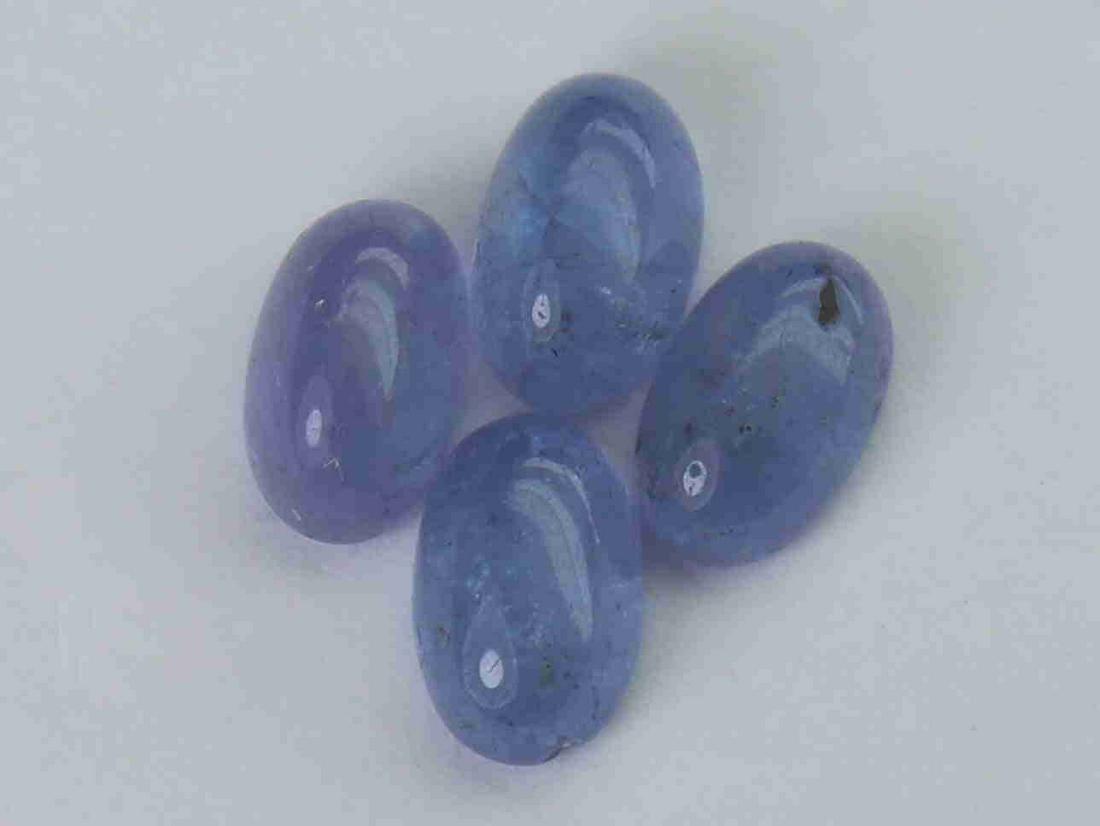 2.27 cts Natural Tanzanite Lot: No Reserve! Gemstone : Natural Tanzanite Shape and cut : Oval cabochan Weight : 2.27 Carats Measurements : 6x4.5 mm Number of Stone : 4 Color : voilite Transprancy : Transparent Treatment : No Treatme