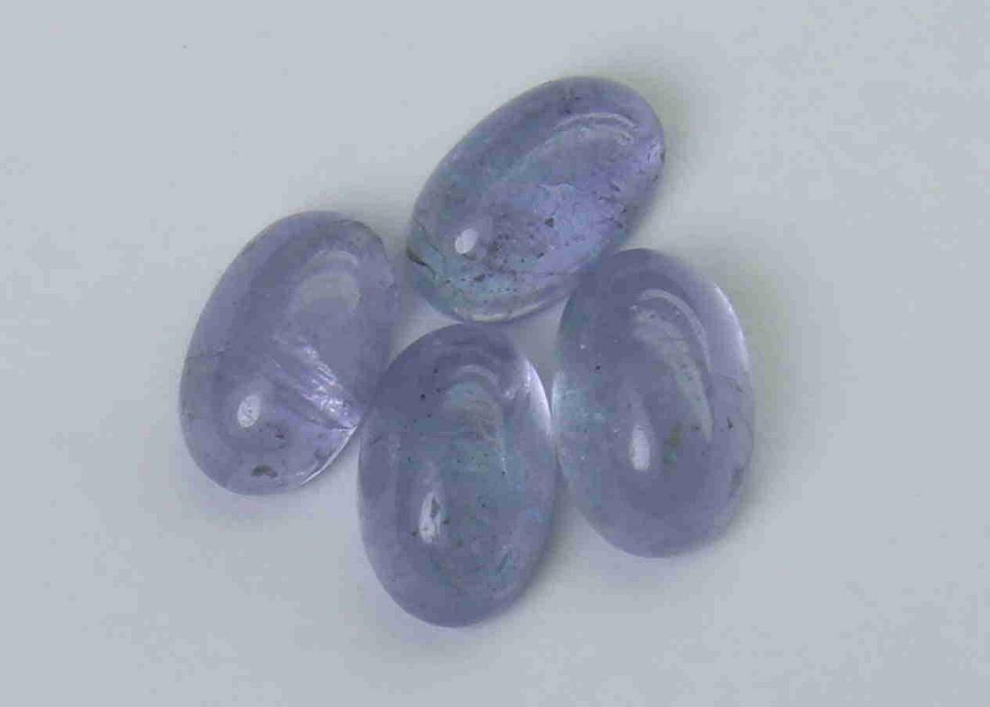 2.21 cts Natural Tanzanite Lot: No Reserve! Gemstone : Natural Tanzanite Shape and cut : Oval cabochan Weight : 2.21 Carats Measurements : 5.96x3.83x2.90 mm - 5.67x3.60x2.42 mm Number of Stone : 4 Color : voilite Transprancy : Trans