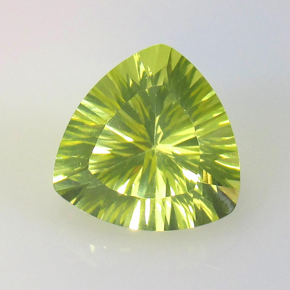 5.52 Ctw Natural Lemon Quartz Trillion Concave Cut: No Reserve! Title: 5.52 Ctw Natural Lemon Quartz Trillion Concave Cut Stone Clarity: VVS Gemstones: Lemon Quartz Carat Weights: 5.52 Size/Dimensions: 12.00 x 11.90 x 8.00 mm Additional Information: Ex