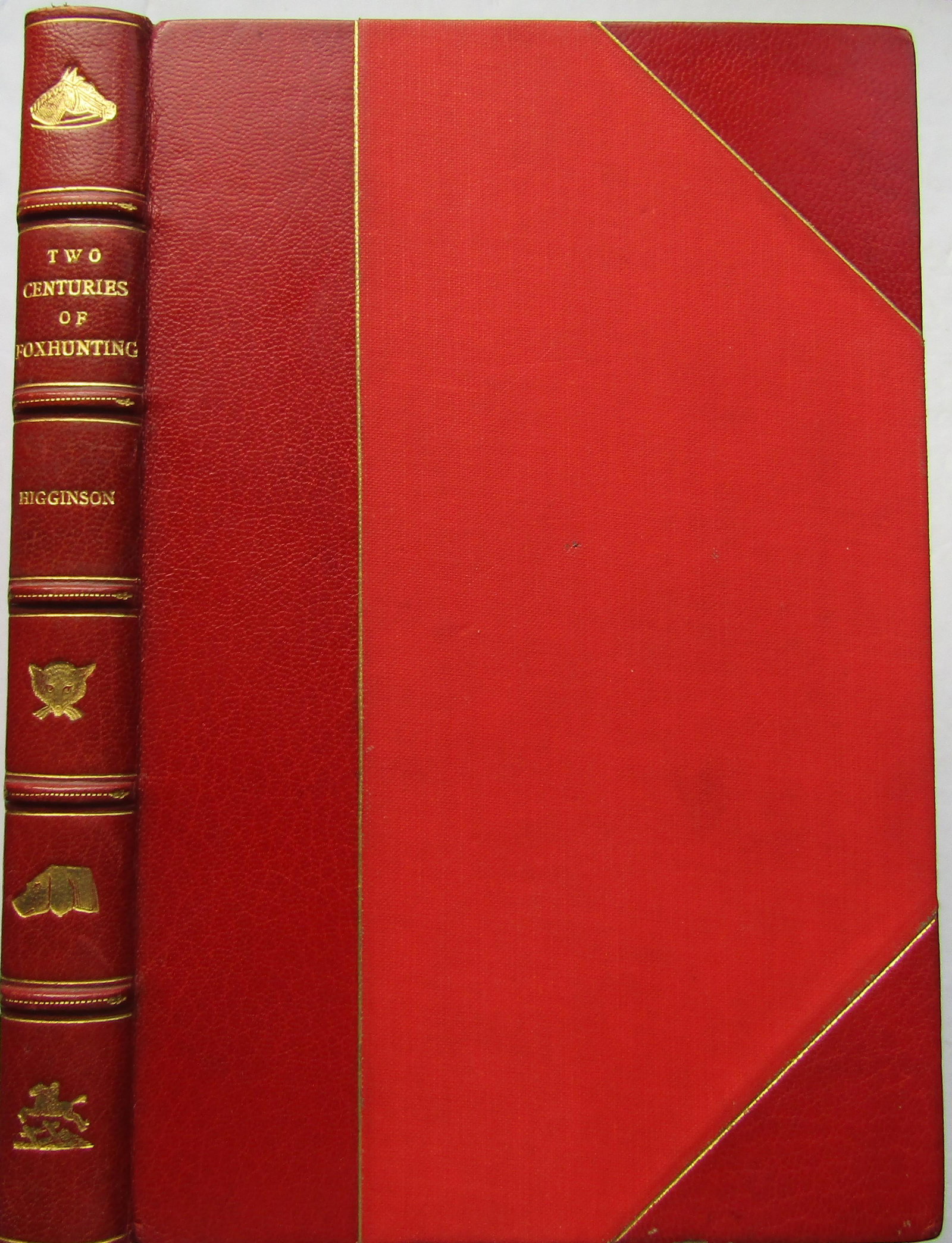 Two Centuries of Foxhunting: First edition. Half-leather over red cloth boards with gilt borders. Gilt title, gilt raised bands and gilt panel vignettes to spine. Gilt top page-block. Name on inside. Frontispiece plate. 16 full-p