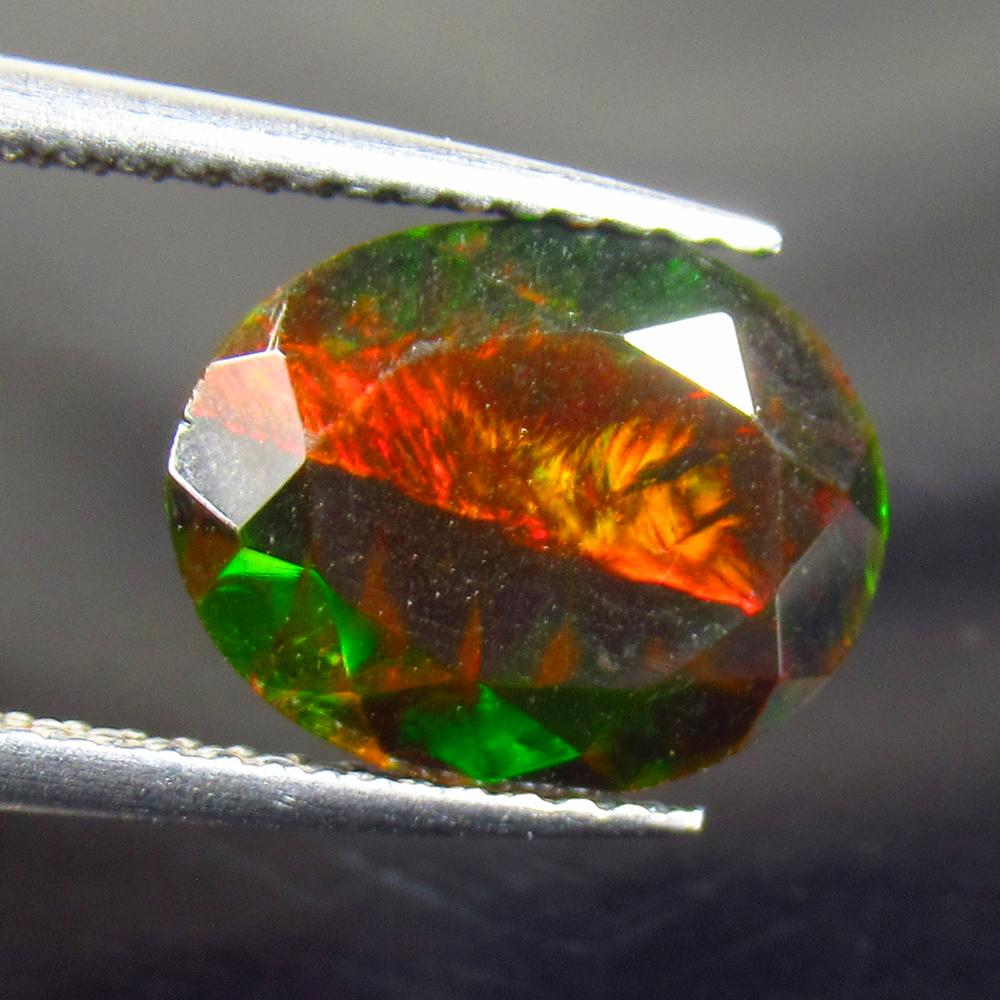 2.56 Ct Natural Black Fire Opal Oval Cut (1 of 3)