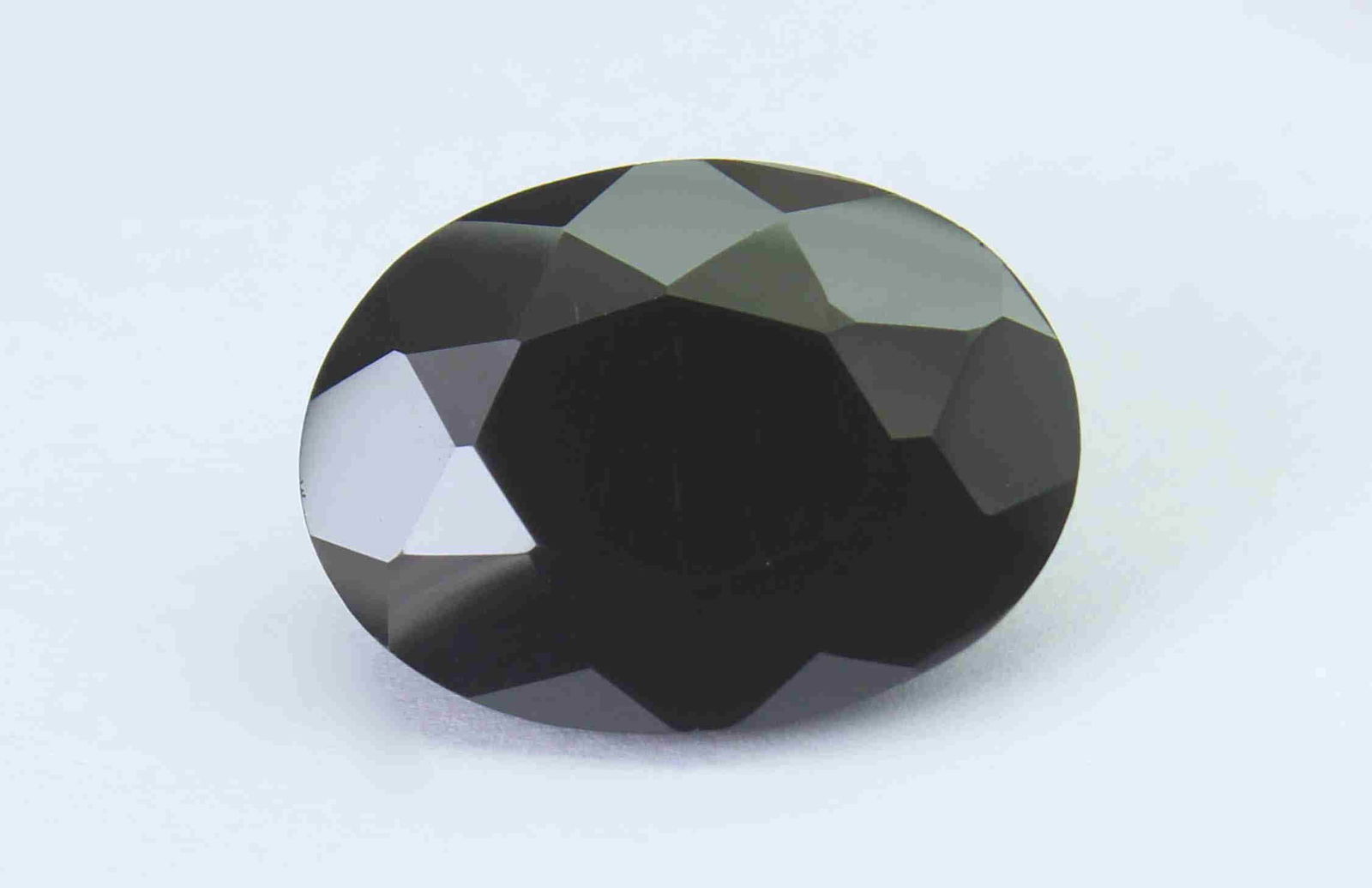 16.32 Cts Natural Black Spinel: No Reserve! Title: 16.32 Cts Natural Black Spinel Additional Information: Gemstone : Natural Black Spinel Shape and cut : Oval Cut Weight : 16.32 Carats Measurements : 18x13 mm Color : Black Transpran