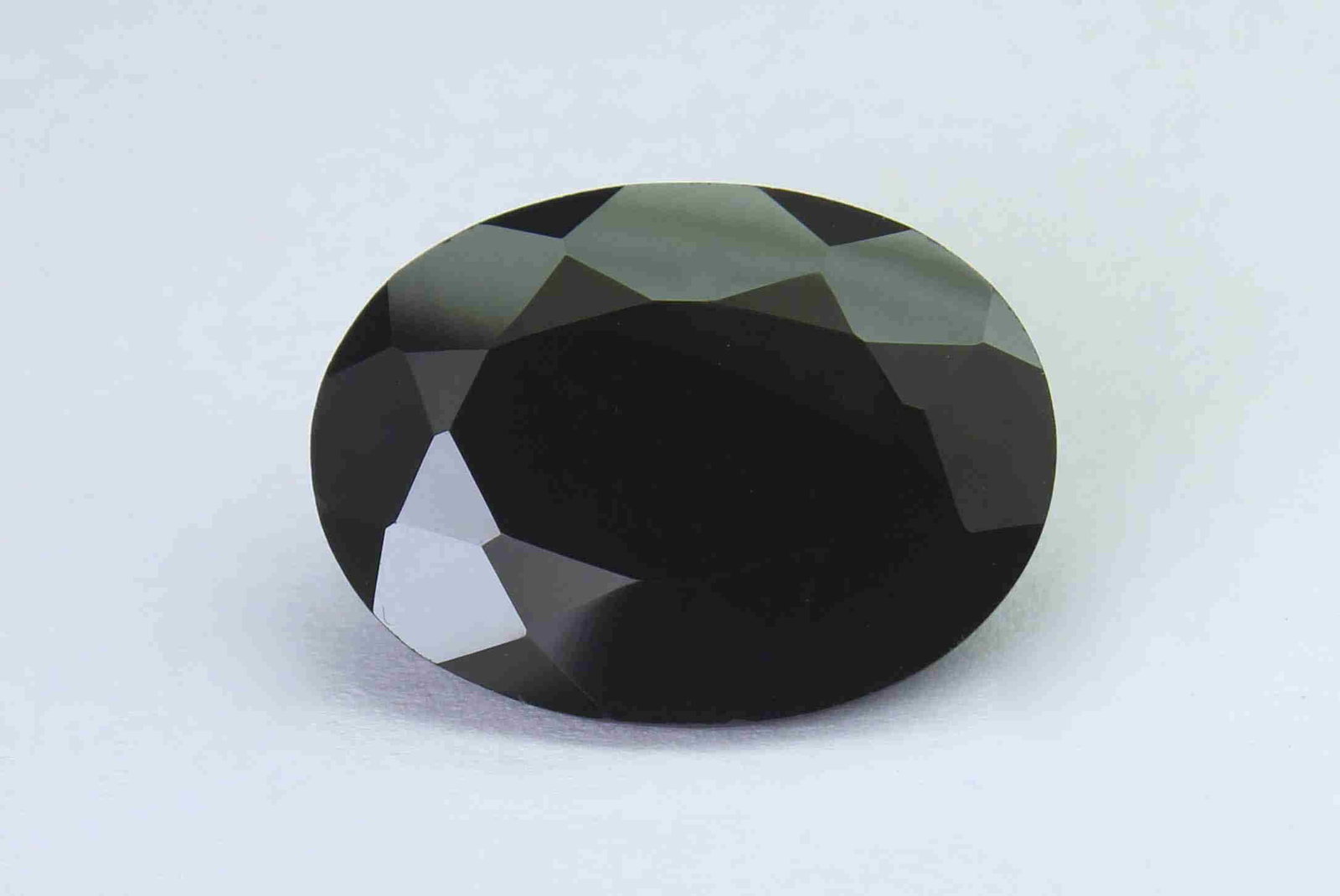 13.87 Cts Natural Black Spinel: No Reserve! Title: 13.87 Cts Natural Black Spinel Additional Information: Gemstone : Natural Black Spinel Shape and cut : Oval Cut Weight : 13.87 Carats Measurements : 18x13 mm Color : Black Transpran