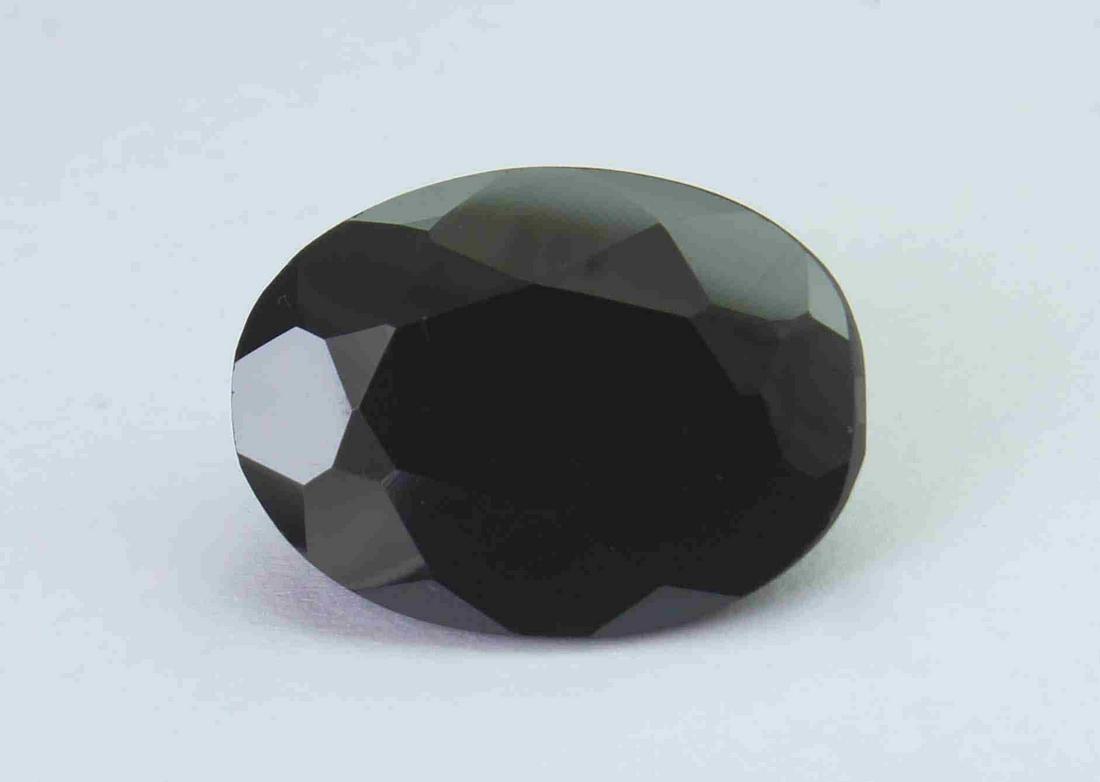 16.24 Cts Natural Black Spinel: No Reserve! Title: 16.24 Cts Natural Black Spinel Additional Information: Gemstone : Natural Black Spinel Shape and cut : Oval Cut Weight : 16.24 Carats Measurements : 18x13 mm Color : Black Transpran