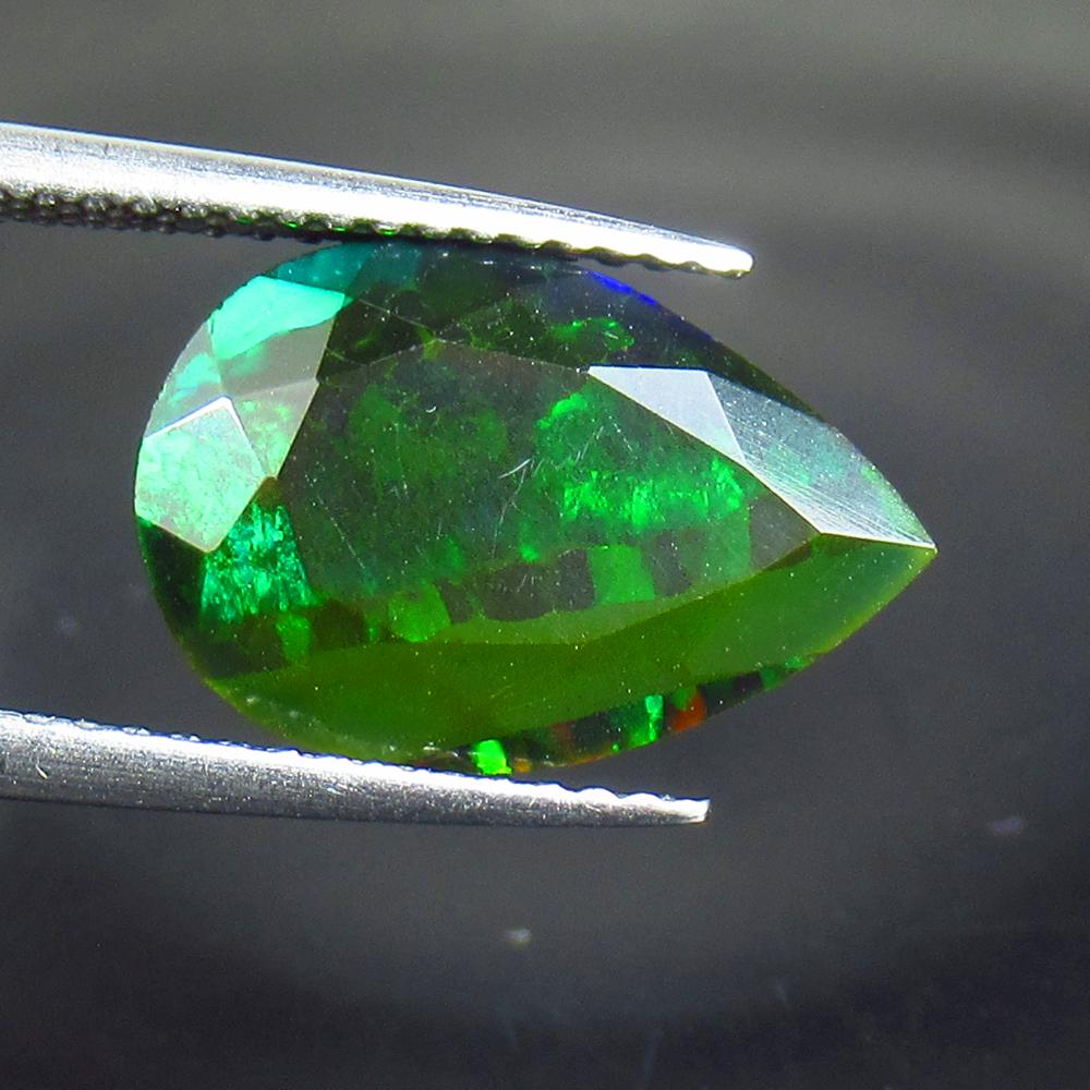 2.93 Ctw Natural Ethiopian Black Fire Opal Pear Cut: No Reserve! Title: 2.93 Ctw Natural Ethiopian Black Fire Opal Pear Cut Stone Clarity: Translucent Gemstones: Black Opal Carat Weights: 2.93 Size/Dimensions: 14.30 x 9.60 x 5.70 mm Additional Informati