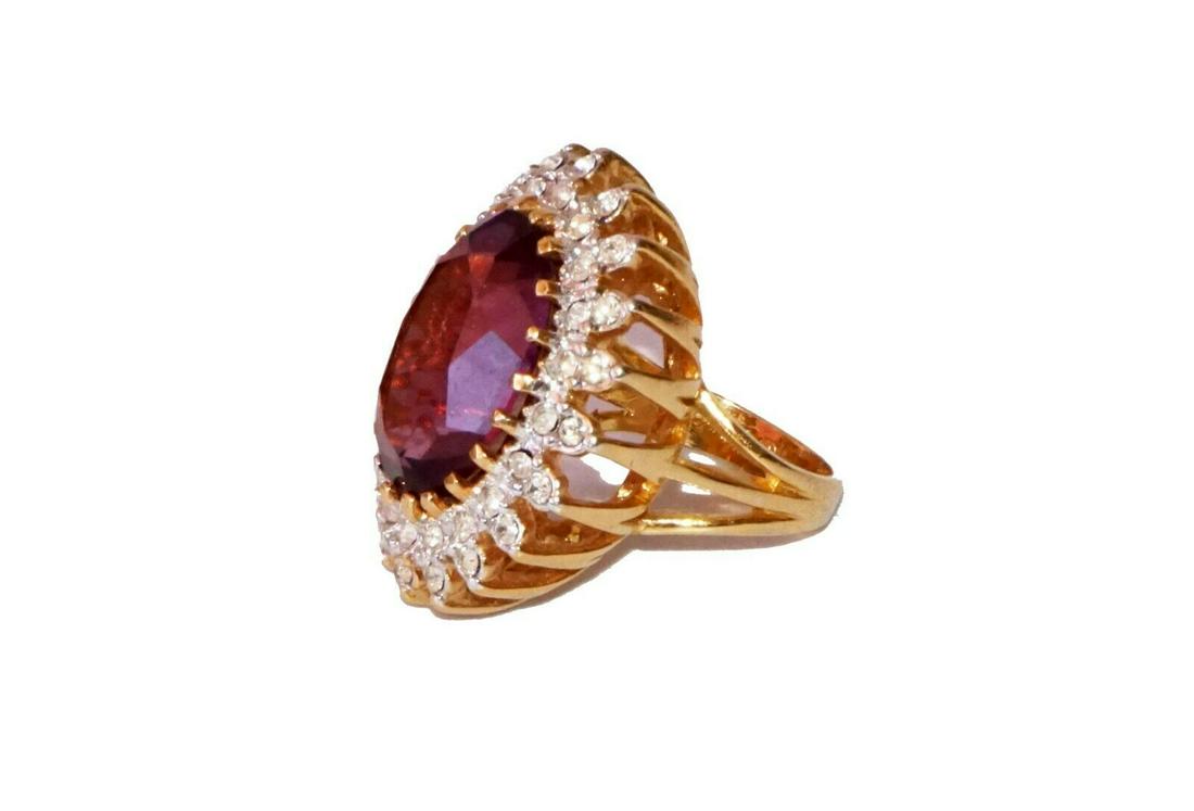 Costume Jewelry Ring Synthetic Amethyst (Val): Item: Up for sale from a recent estate in Honolulu Hawaii, this fun over the top Vintage costume yellow gold plated ladies ring in a size 6.5 that is center set with a synthetic amethyst (20mm x 15mm)