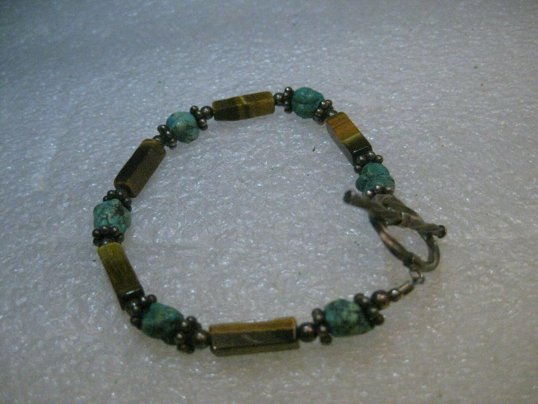 Sterling Southwestern Tiger's Eye & Turquoise Bracelet,: Vintage Southwestern Tiger's Eye and Turquoise beaded bracelet with sterling silver toggle clasp - did not test fluted beads. This has natural tiger's eye square tube beads that are about 2/3" long -