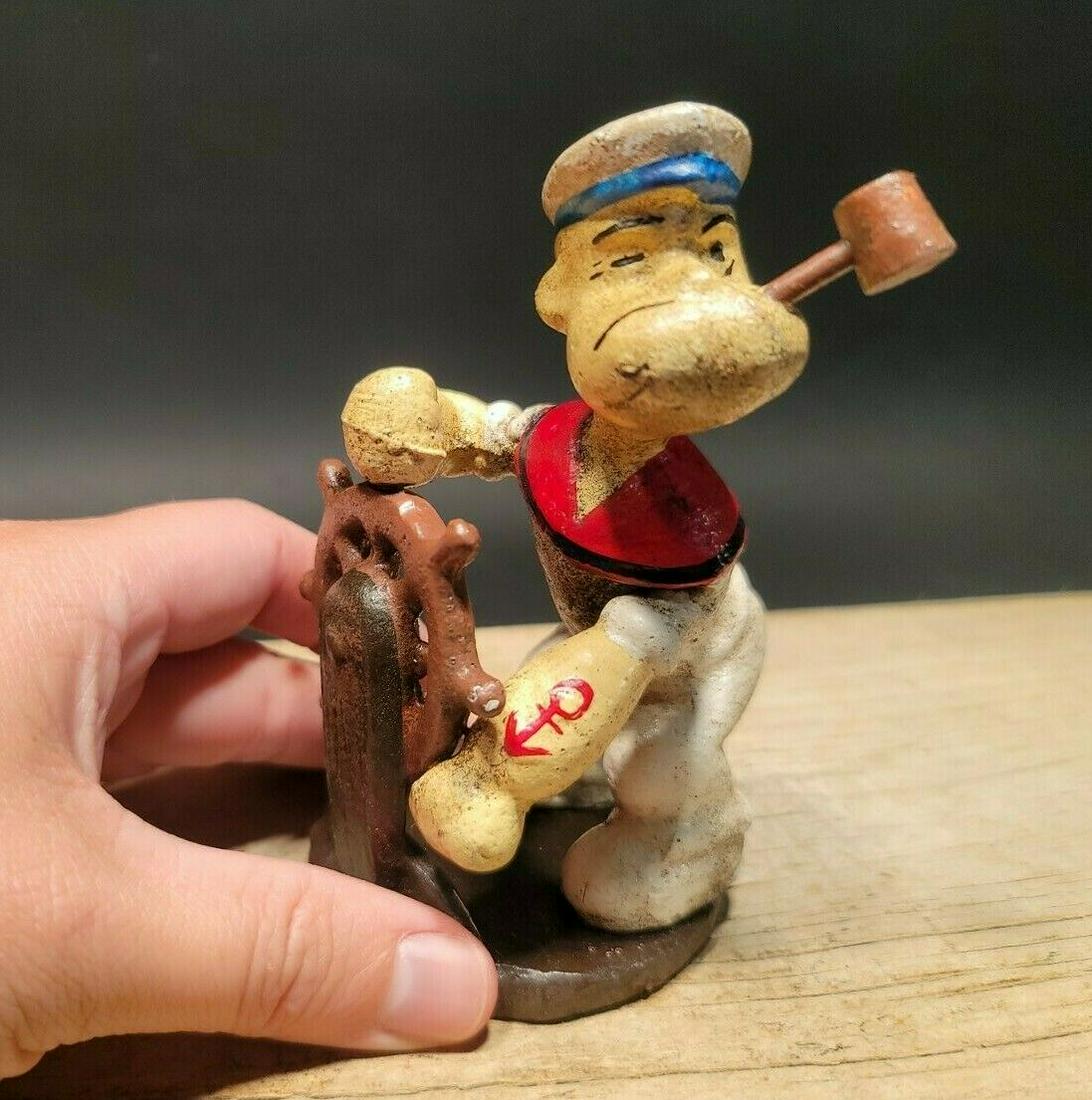 Cast Iron Popeye Sailor Captain Figure Statue: 5" Tall Such a neat cast iron statue! As you can see this heavy cast iron car was wonderfully hand painted. Very solid! Looks great on display! Reserve: $25.00 Shipping: Domestic: Flat-rate of $18.00 