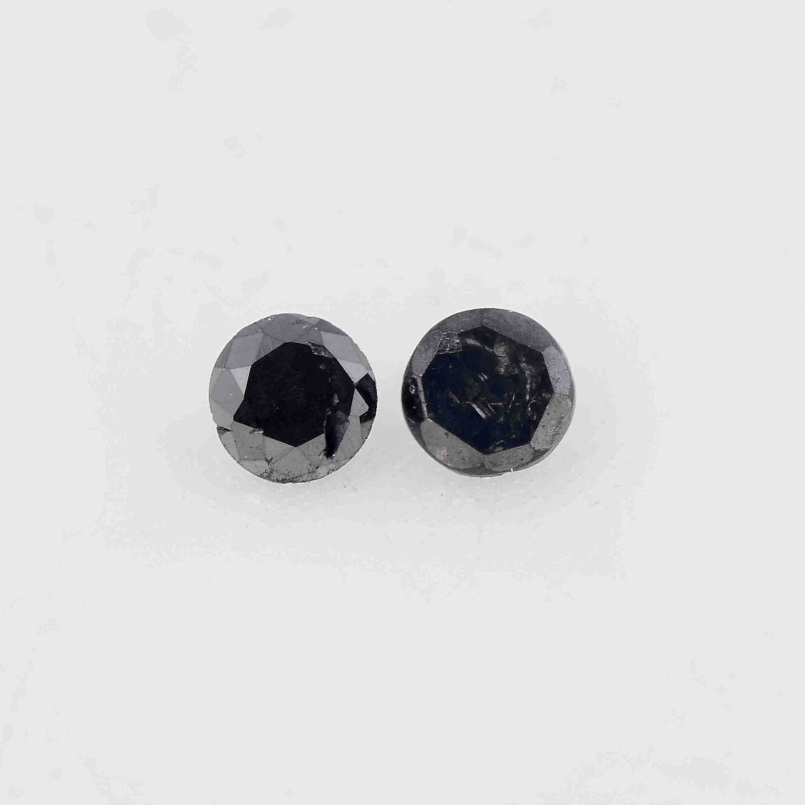0.03 Carat Fancy Black Color Natural Round Diamond: No Reserve! Title: 0.03 Carat Fancy Black Color Natural Round Diamond Loose Gemstone 2 Pieces Additional Information: Specification of Gemstone * Stone : Diamond * Shape : Round * Size : 1.5L x 1.5W m