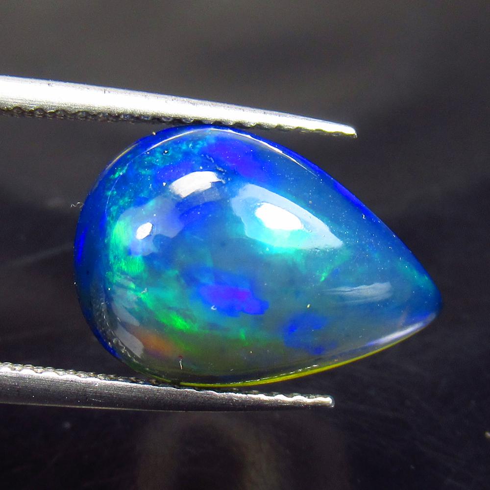 4.06 Ctw Natural Ethiopian Black Fire Opal Pear Cab: No Reserve! Title: 4.06 Ctw Natural Ethiopian Black Fire Opal Pear Cab Stone Clarity: Translucent Gemstone: Black Opal Carat Weights: 4.06 Size/ Dimensions: 15.80 x 10.80 x 5.50 mm Additional Info: Ex