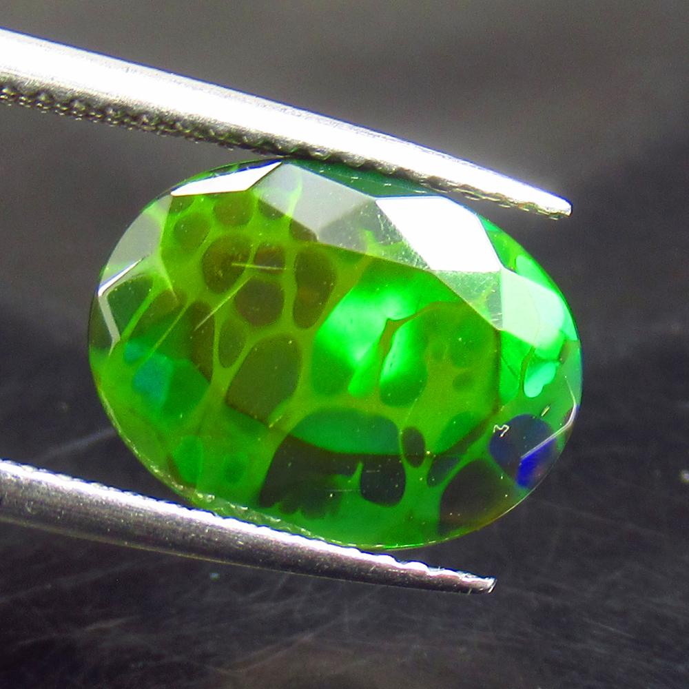 2.16 Ctw Natural Ethiopian Black Fire Opal Oval Cut: No Reserve! Title: 2.16 Ctw Natural Ethiopian Black Fire Opal Oval Cut Stone Clarity: Translucent Gemstone: Black Opal Carat Weights: 2.16 Size/ Dimensions: 12.60 x 9.60 x 4.60 mm Additional Info: Exc