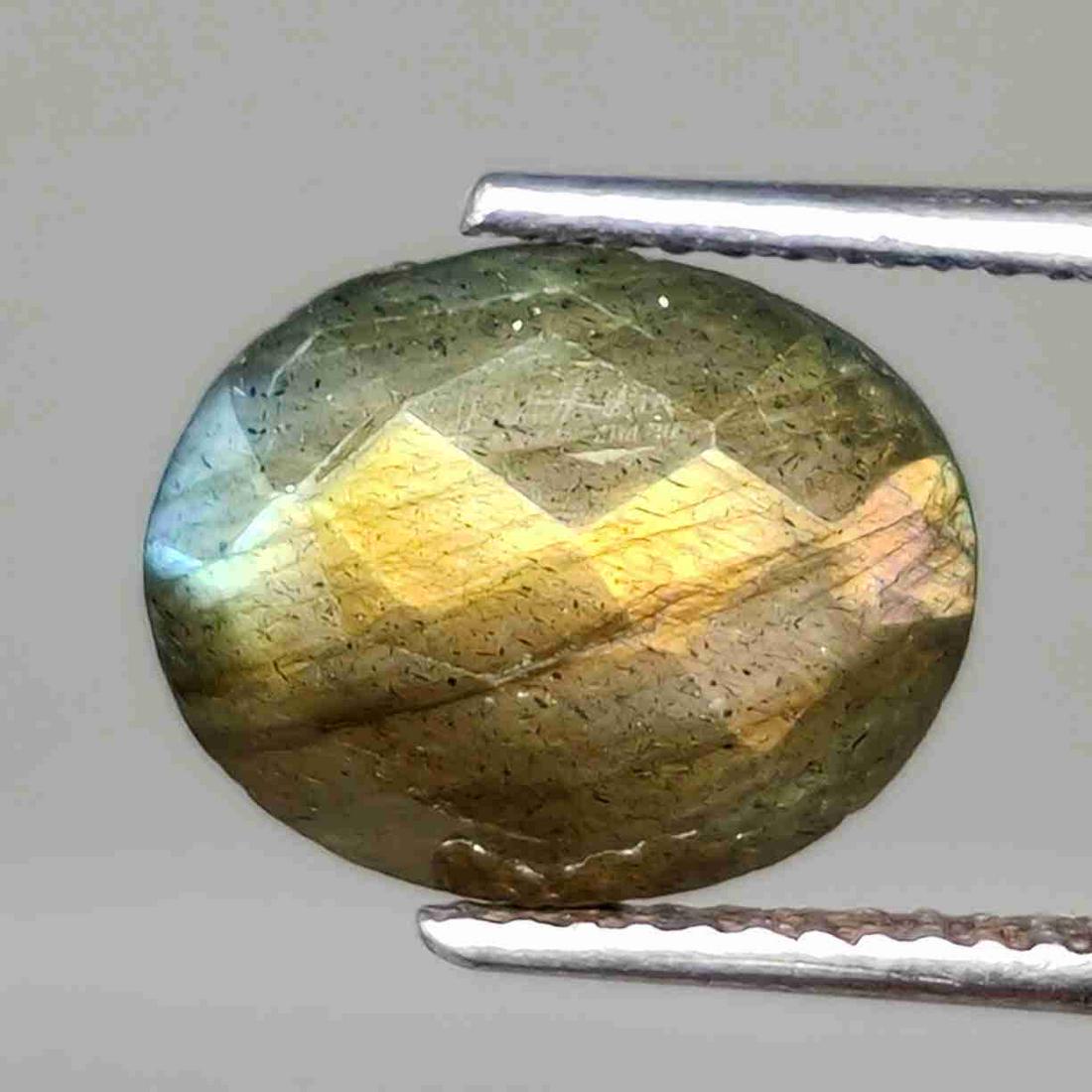 4.05 ct Natural Faceted Labradorite: No Reserve! Title: 4.05 ct Natural Faceted Labradorite Description: Gemstones: Labradorite Carat Weights: 4.05 ct Size/Dimensions: 11 X 9 mm Origin : Labrador Materials & Techniques: Labradorite Weigh