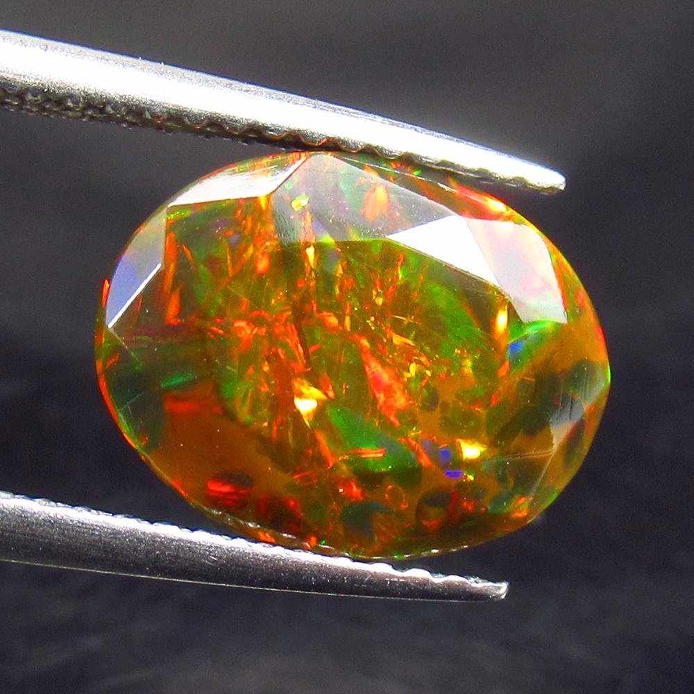 1.90 Ctw Natural Ethiopian Black Fire Opal Oval Cab: No Reserve! Title: 1.90 Ctw Natural Ethiopian Black Fire Opal Oval Cab Stone Clarity: Translucent Gemstone: Black Opal Carat Weights: 1.90 Size/ Dimensions: 11.40 x 8.80 x 5.10 mm Additional Info: Exc