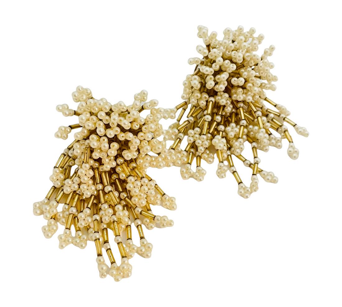 Vintage gold pearl waterfall cluster drop disco clip on: DETAILS • unsigned • pearls with gold seed beads • vintage designer runway clip on earrings MEASUREMENTS • 3 1/4" by 2" CONDITION • excellent vintage condition with minim