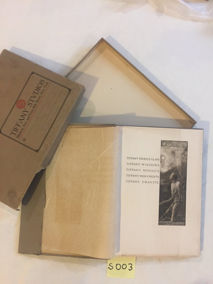 Memorials in Glass and Stone.: Tiffany Studios. First Edition. 1913. Printed by Munder-Thomsen, New York. In original slipcase, with grey wrappers, debossed lettering on front cover. Numerous photogravure plates. Distributed by Lou
