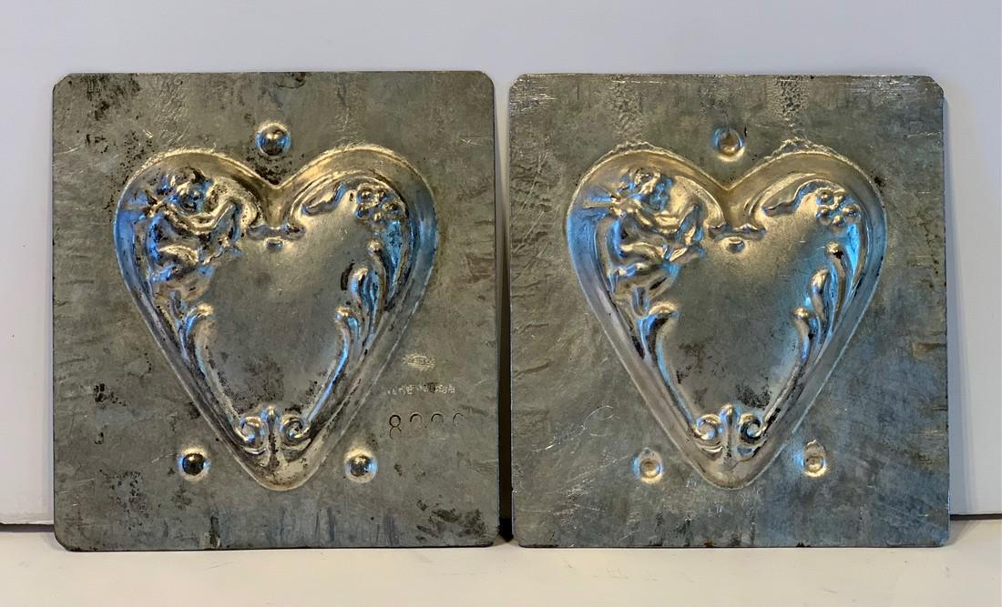 Heart motif Chocolate Mold, early 20th c: Title: Heart motif Chocolate Mold, early 20th c Date/Period: Early 20th c Dimension: 4 1/2 in. x 5 in. Additional Information: Floral edge motif. Nice patina. Shipping: Domestic: Flat-rate of $25.00 t