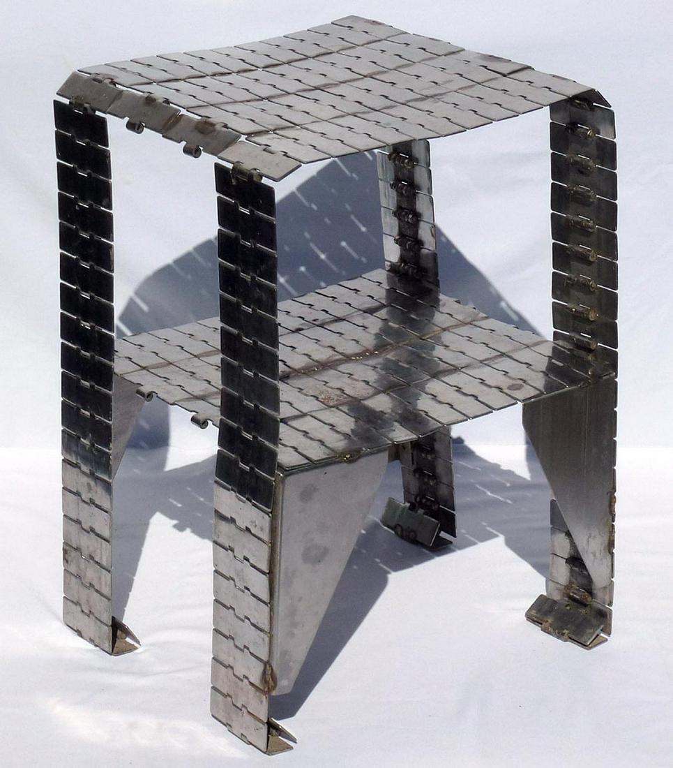Folk Art Table from stainless steel industrial conveyor: Title: Folk Art Table from stainless steel industrial conveyor belt Provenance/Additional Info: This is a folk art table hand made from stainless steel industrial conveyor belt. Each of the links was
