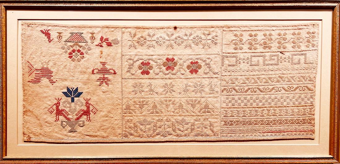 Early needlework sampler in three sections. (1 of 4)