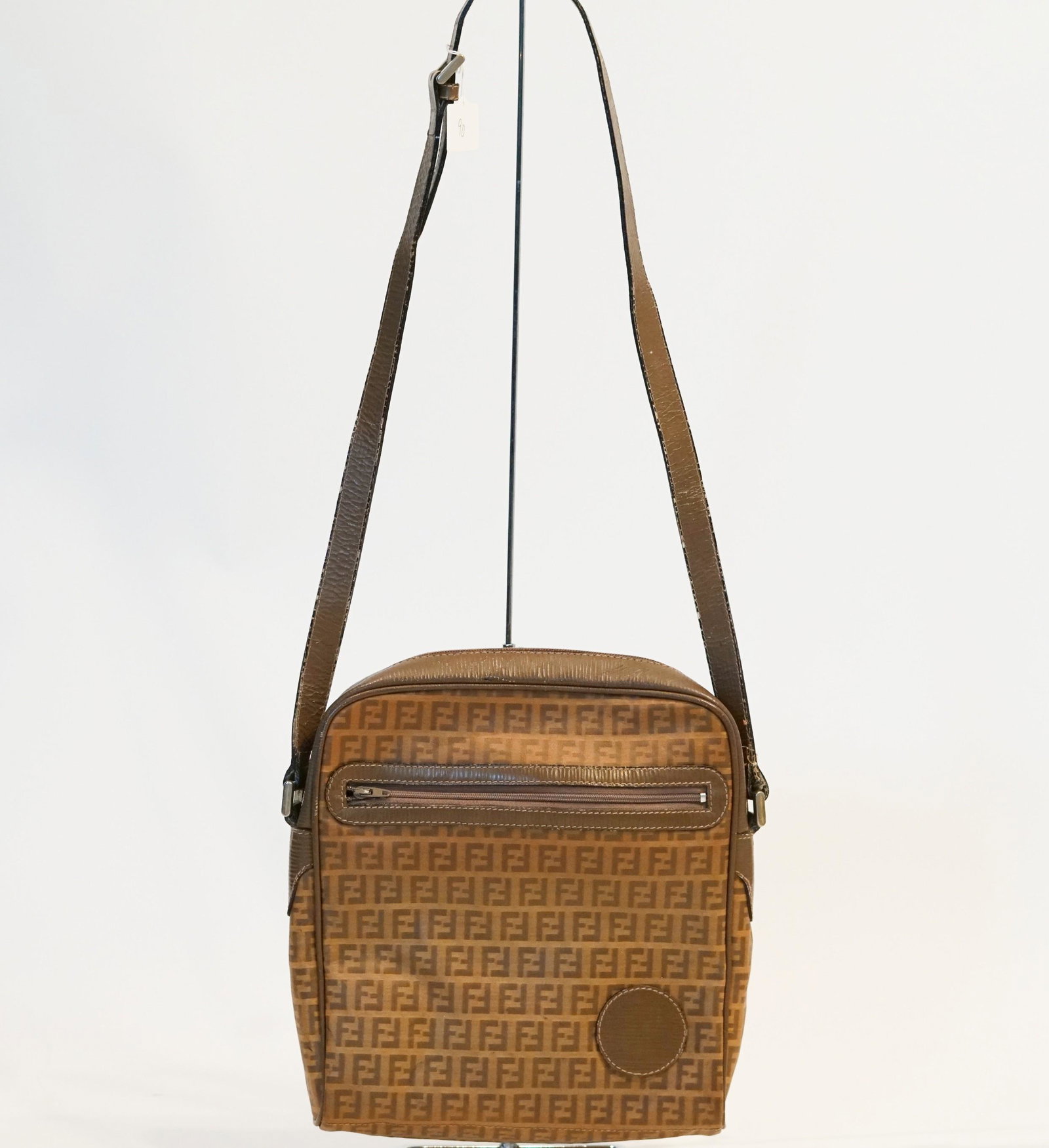 Vintage Fendi Zuchino Crossbody: Title: Vintage Fendi Zuchino Crossbody Material: Coated Canvas Size/Dimensions: L 9 W 2 H 10 SD 20 Description: This item has visible signs of wear Reserve: $100.00 Shipping: Domestic: Flat-rate of $1