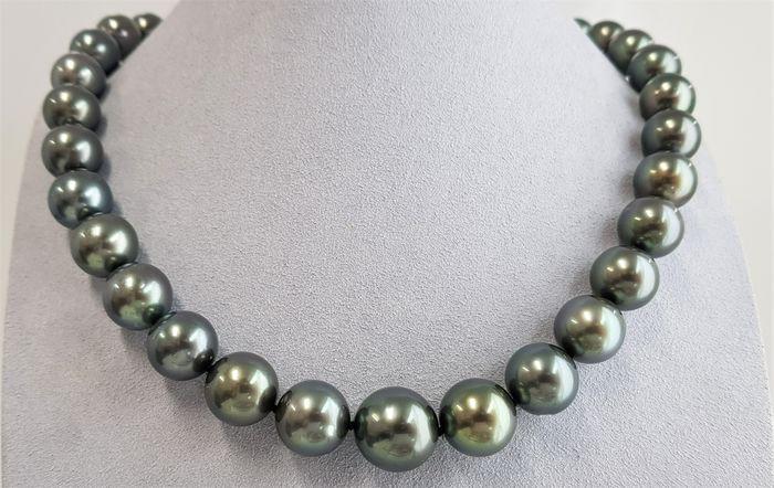 11x14.5mm Large Green Tahitian Pearls - 14 kt. Yellow: Title: 11x14.5mm Large Green Tahitian Pearls - 14 kt. Yellow gold - Necklace Description: A luxury pearl necklace, made with round Tahitian pearls, and completed with a solid invisible clasp. Tahitian