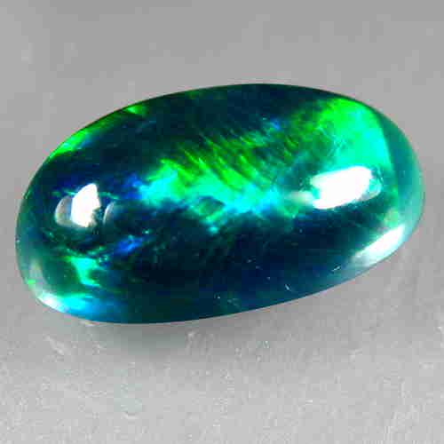 2.10Cts Natural Multi color Black Opal Oval Cabochon: Title: 2.10Cts Natural Multi color Black Opal Oval Cabochon Good Luster loose gemstone Carat Weights: 2.1 Size/Dimensions: 12.20x7.30x4.70 MM Additional Information: HEATED WITH PLAY OF COLOR Reserve: