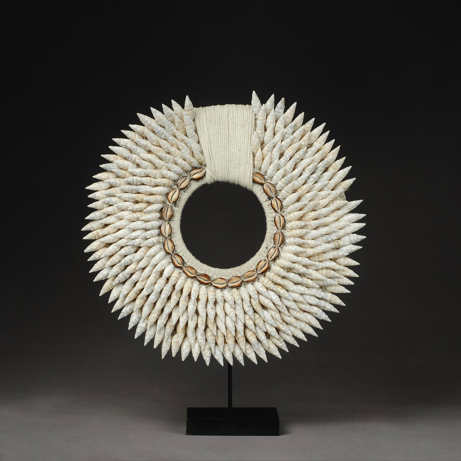 Papua Shell Necklace: Title: Papua Shell Necklace Origin: Asian private collection Date/Period: 20th Materials: Shell Size: Shell necklace: 45x45cm Bracket + necklace: 45x55 cm Description: This is a fabulous old tradition