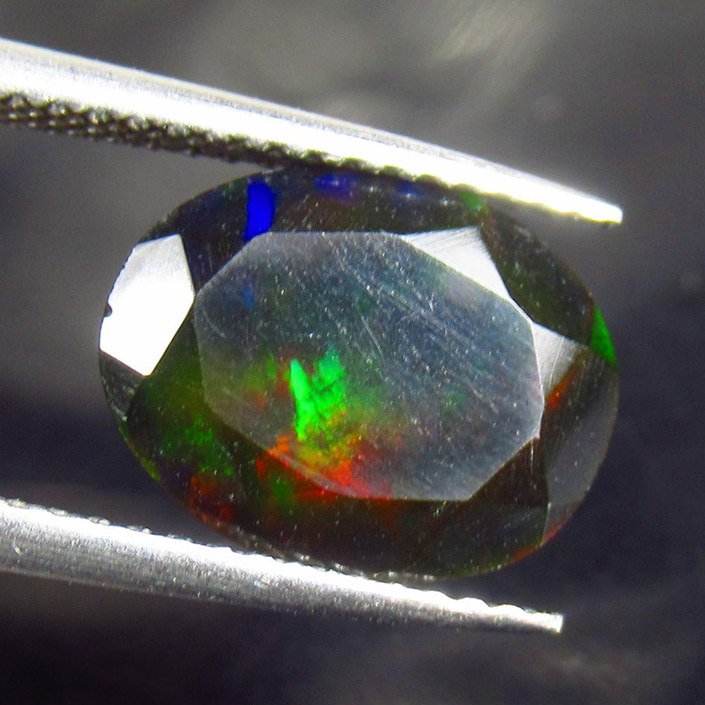 2.13 Ctw Natural Ethiopian Black Fire Opal Oval Cut: No Reserve! Title: 2.13 Ctw Natural Ethiopian Black Fire Opal Oval Cut Stone Clarity: Translucent Gemstones: Black Opal Carat Weights: 2.13 Size/Dimensions: 11.50 x 9.10 x 5.00 mm Additional Informati