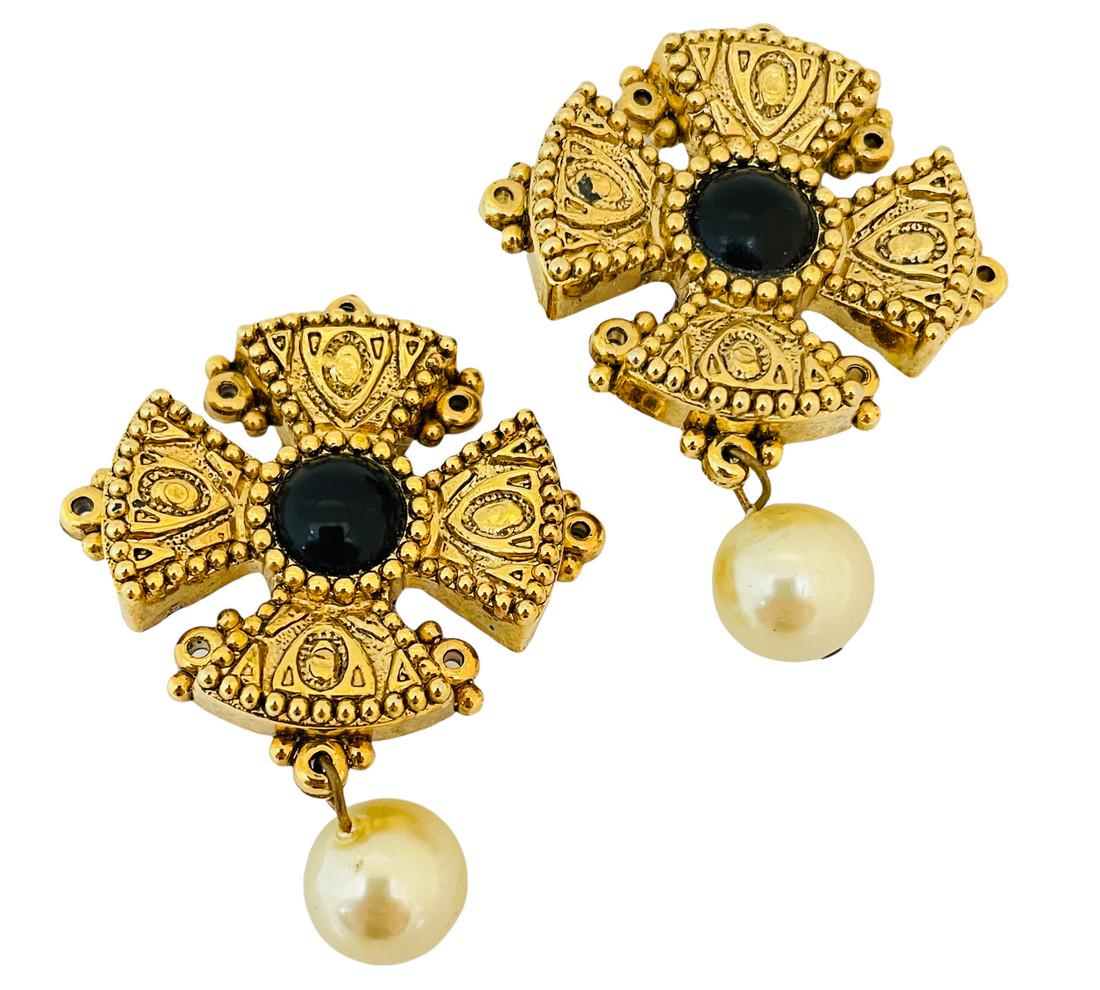 Vintage gold Maltese cross pearl designer runway clip on earrings: DETAILS • unsigned • gold tone with pearl • vintage designer runway earrings MEASUREMENTS • 2 1/4" 1 5/8" CONDITION • excellent vintage condition with minimal signs of we