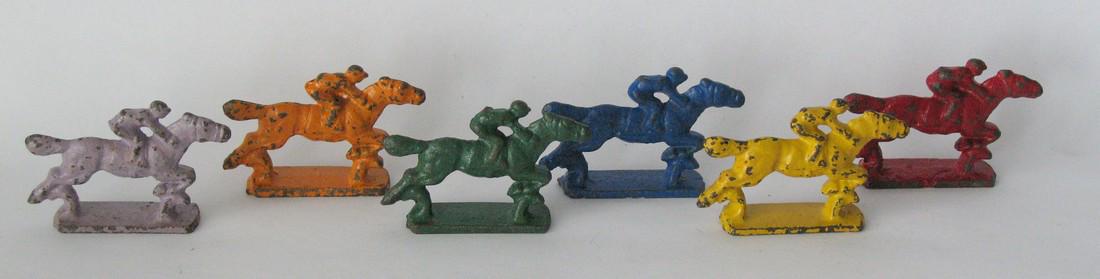 Vintage cast iron horse and jockey toy set.: Title: Vintage cast iron horse and jockey toy set. Date/Period: 1930's Dimension: 2 1/2" long each Additional Information: Nice vintage cast iron horse & jockey toy set in great original paint & condi