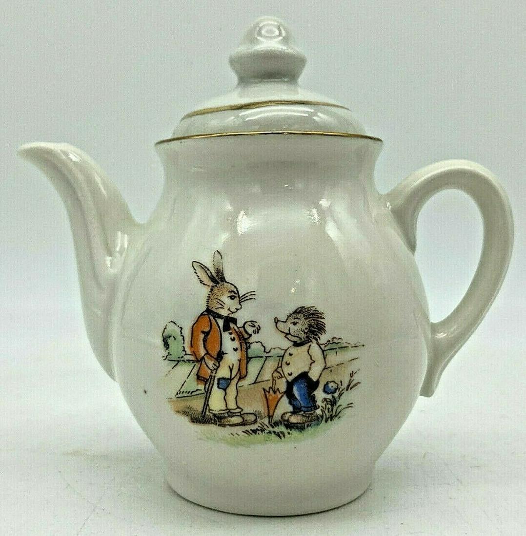 VINTAGE GRIMMS FAIRY TALE HARE AND HEDGEHOG TEAPOT: Title: VINTAGE GRIMMS FAIRY TALE HARE AND HEDGEHOG TEAPOT Date/Period: Dimension: approx: 4 x 4 Materials: ceramic Additional Information: such charm and a wonderful additon to any vintage kitchen or 