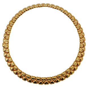 Cartier 1994 Yellow Gold Heart Shaped Collar Necklace: A gorgeous glossy heart shaped collar necklace by Carteir, circa 1994. Made of 18k yellow gold. Stamped with Cartier maker's mark, a hallmark for 18k gold, a year of production and a serial number.