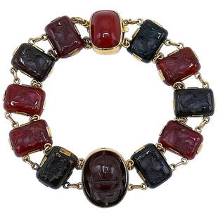 Victorian Yellow Gold Carved Carnelian Cameo Bracelet: Victorian carved carnelian cameo bracelet with ten rectangular cameos depicting classical female profiles. The central carnelian is a spinner: one side is a scarab, another has a carved figure of a
