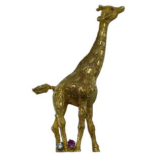 Vintage Cartier Yellow Gold Diamond and Ruby Giraffe Brooch: Product details: The brooch is designed by Cartier, it is made out of 18 karat yellow gold with one round brilliant cut diamond and two rubies. The brooch is signed Cartier, numbered 18457, stamped