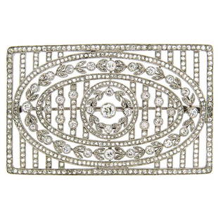 Edwardian Diamond & Platinum Brooch Pin 1920's: Classic Edwardian brooch created in Europe in the 1920's. Old hand-cut diamonds, open-work airy design, floral motifs are the highlights of this lovely timeless piece. Diamond total weight 3.47