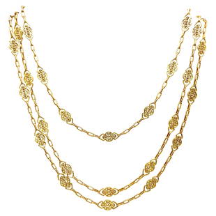 French Antique Yellow Gold Filigree Watch Chain Necklace: An amazing extra long French antique chain necklace. Made of 18k yellow gold. Features filigree links and a watch chain clasp suitable to hang a pendant. Stamped with French marks and a maker's mark.