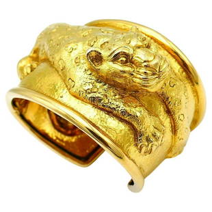 David Webb Yellow Gold Repousse Leopard Cuff Bracelet: A spectacular sculptural Leopard cuff bracelet made of 18k yellow gold by David Webb. From Kingdom Collection. Stamped with David Webb maker's mark and a hallmark for 18k gold. Measurements: inner