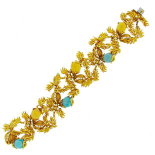 1980s Cartier A. Cipullo Citrine Topaz Diamond Gold Floral Motif Bracelet: Beautiful whimsical bracelet created by Aldo Cipullo for Cartier in the 1980s. Inspired by nature's floral motifs, the bracelet is made of 18 karat yellow gold and set with oval cabochon topaz,