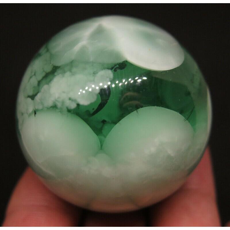 82g Sphere ball lava stone obsidian mineral crystal: MATERIAL: Green, White Lava stone CONDITION: Very good condition Size: 1,5 inch (39 mm) Weight: 2,9 oz (82 g) Since ancient times, lava stone has been considered the Child of the Earth. Coming out of 