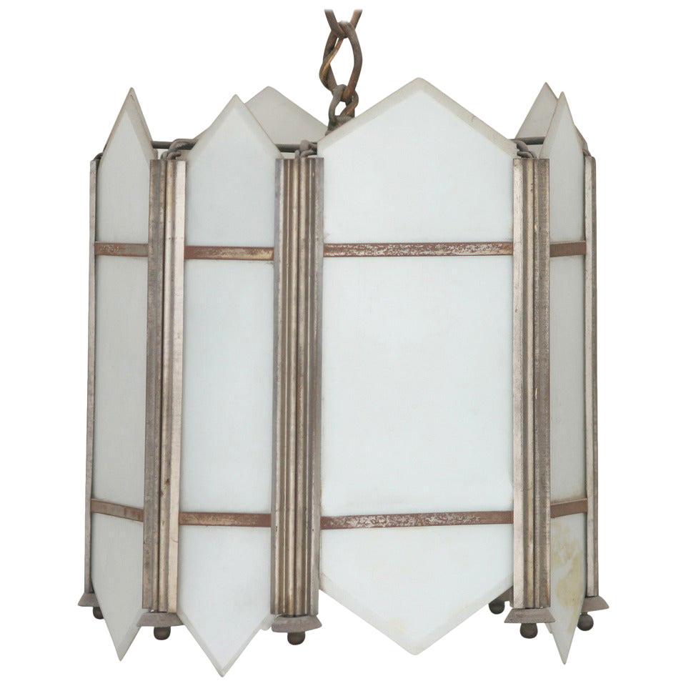 Art Deco Slat Glass Pendant Light: Made circa 1920, this Art Deco ceiling pendant has an intricate geometric design with slat white flash opal glass inserts. Details Dimensions Height: 11 in. (27.94 cm)Diameter: 10 in. (25.4 cm) Style