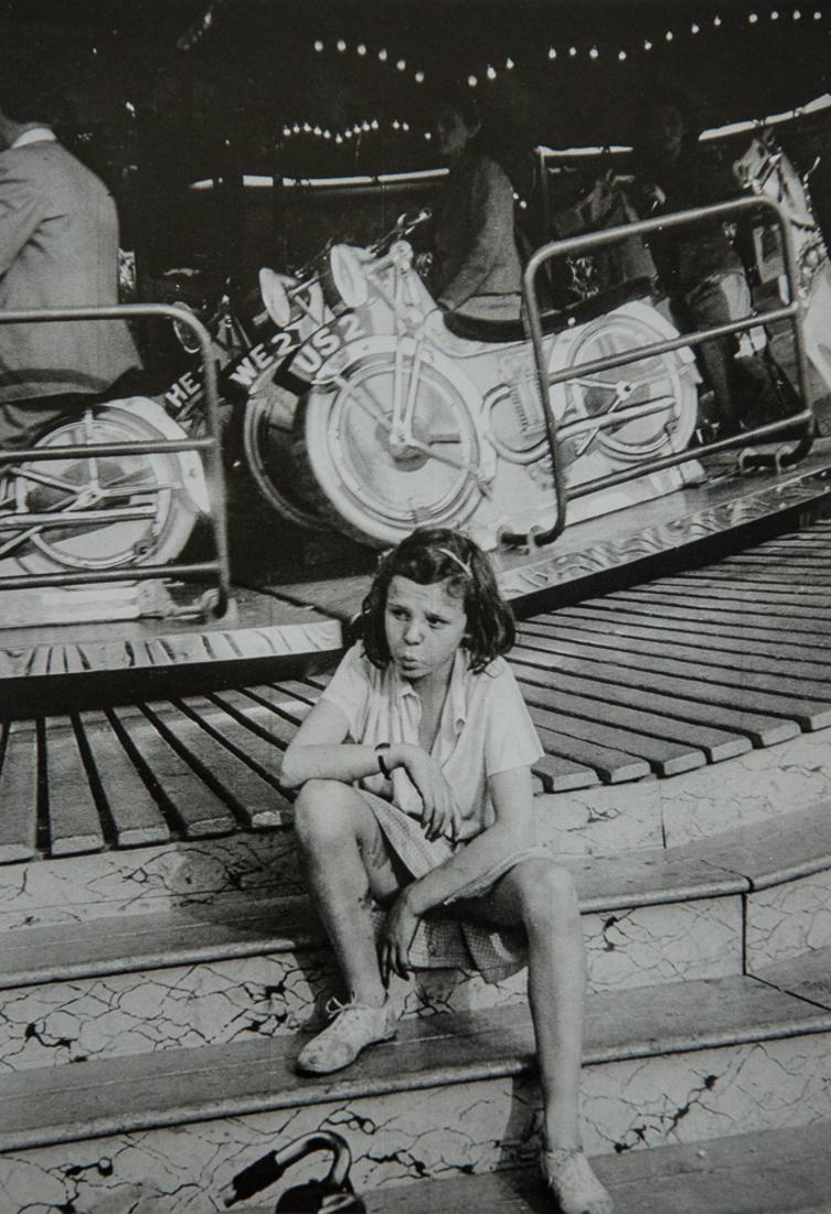 KURT HUTTON - One at the Fair, 1942: Artist: Kurt Hutton Description: One at the Fair, 1942 Medium: Sheet Fed Gravure, 1976, England Dimension: 6.9x10.15" Description: Heat Wax Mounted on 11x14" Conservation Board Kurt Hutton (born Kurt 
