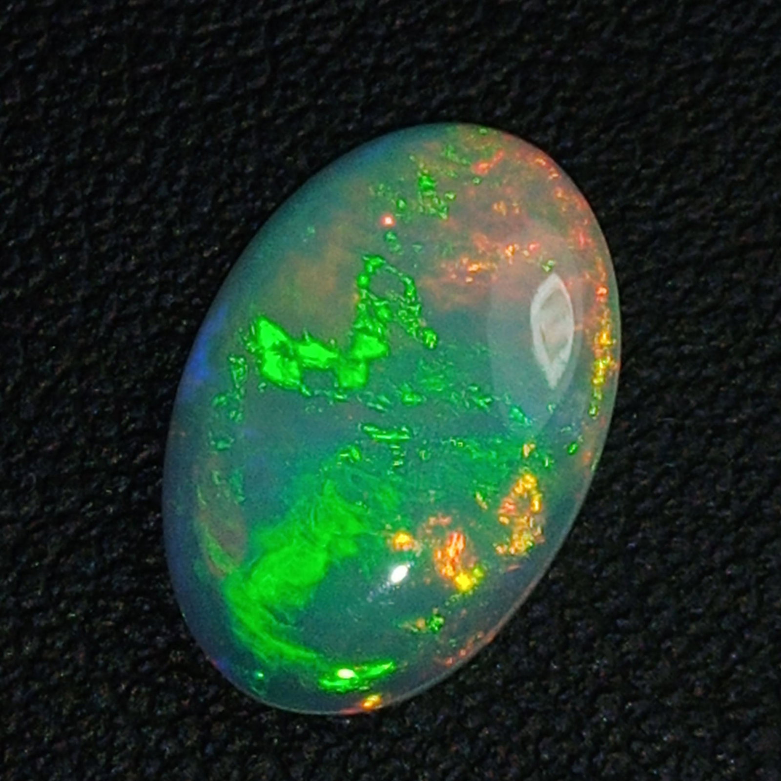 2.13 CTS NATURAL ETHIOPIAN MULTI COLOR WELO OPAL OVAL GOOD LUSTER GEMS: Title: 2.13 CTS NATURAL ETHIOPIAN MULTI COLOR WELO OPAL OVAL GOOD LUSTER GEMS Carat Weights: 2.13 Size/Dimensions: 13.6 x 9.2 x 3.1 MM Additional Information: UNHEATED ETHIOPIA Reserve: $40.00 Shippin
