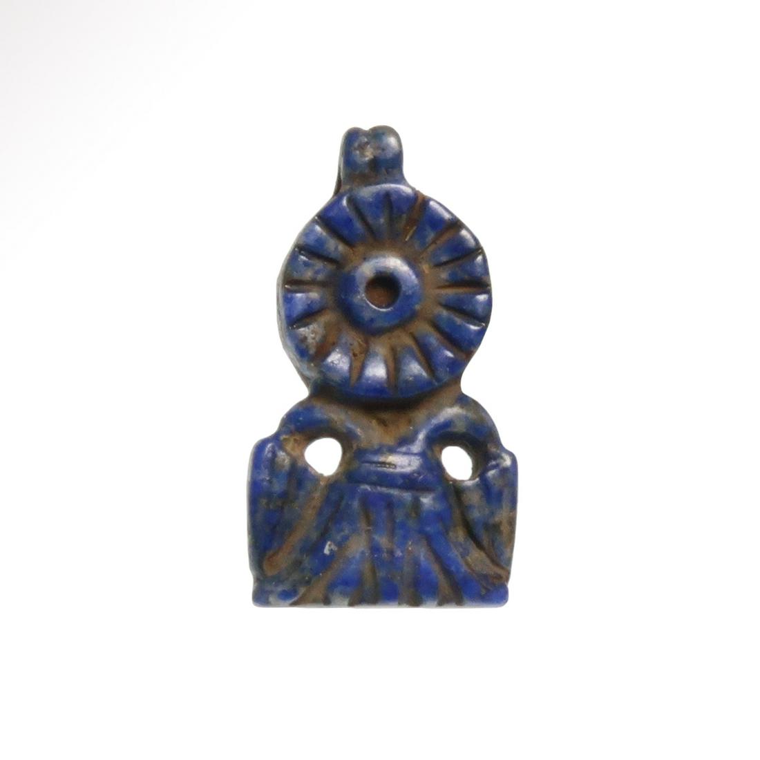 Egyptian Lapis Lazuli Amulet of a Rosette and Lotus Flowers: Title: Egyptian Lapis Lazuli Amulet of a Rosette and Lotus Flowers Date/Origin: Egypt, c. 1200-1000 B.C. Description: An open rosette with lotus flower and two lotus buds below. Loop for suspension. M