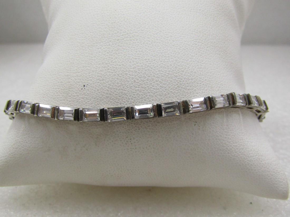 Vintage Sterling CZ Tennis Bracelet, 7.5", Safety Locks: Vintage Sterling CZ Tennis Bracelet, 7.5", Safety Locks. Appx. 3.5mm wide with 4.5mm by 3.5mm rectangular CZs in each link. It is marked .925 and tested. Also signed R. Box clasp with a safety on each