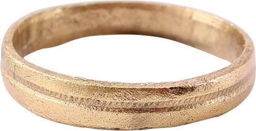 VIKING WOMANâ€™S WEDDING RING, 850-1050 AD, SZ 3: Late 9th-early 11th century AD. Gilt bronze, size 3 3/4 for the small finger as was the custom. Medium band 2.4mm, with a low rounded face with depressed stippled central band. The inside with evidenc