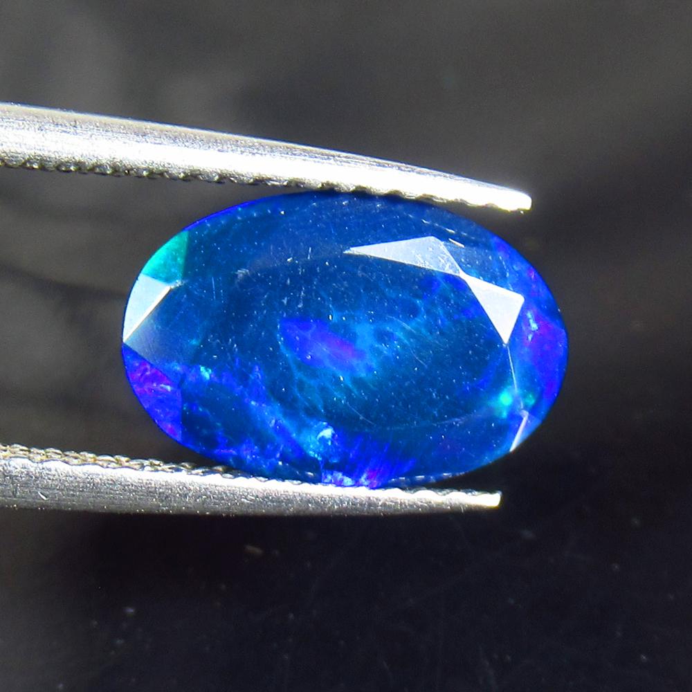 1.55 Ctw Natural Black Fire Opal Oval Cut: Title: 1.55 Ctw Natural Black Fire Opal Oval Cut Clarity: Translucent Gemstone: Natural Opal Carat Weight: 1.55 Dimensions: 11.50 x 7.60 x 4.30 mm Additional Information: Shape - Oval Cut / Color - Bl