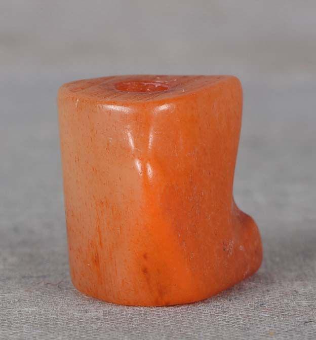 19c staghorn OJIME imitating RED CORAL netsuke cord slide: 19th century staghorn ojime (slide bead for tightening the cord going from netsuke to inro) carved and stained to imitate a section of red coral. Very clever work, nice patina on the surface. Height 1