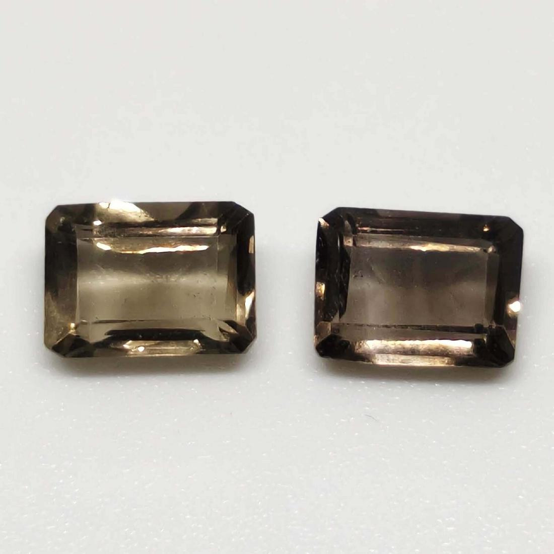2 ct Natural Facetd Smoky Quartz Pair: No Reserve! Title: 2 ct Natural Facetd Smoky Quartz Pair Additional Information: Gemstones: Smoky Quartz Carat Weights: 2 ct Size/Dimensions: 7 X 5 Origin : Scotland Materials: Quartz Shipping: Dome