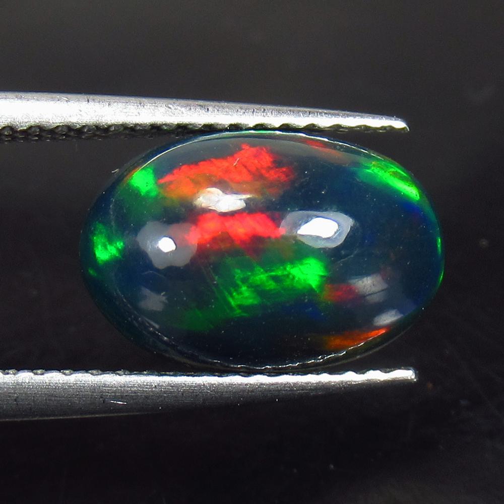 2.26 Ctw Natural Ethiopian Black Fire Opal Oval Cab: No Reserve! Title: 2.26 Ctw Natural Ethiopian Black Fire Opal Oval Cab Stone Clarity: Opaque Gemstones: Natural Black Opal Carat Weights: 2.26 Size/Dimensions: 12.00 x 8.00 x 5.30 mm Additional Inform